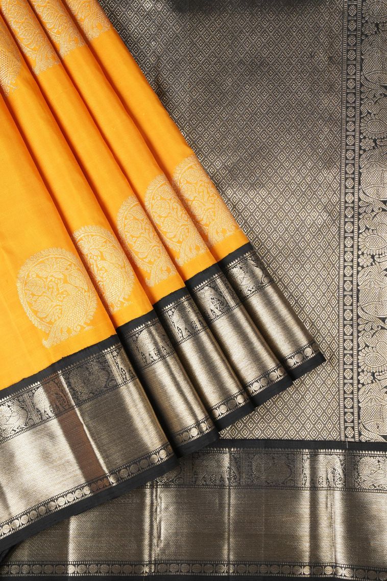 Honey Orange Kanchipuram Silk Sarees with Gold Zari Peacock Motifs view 1