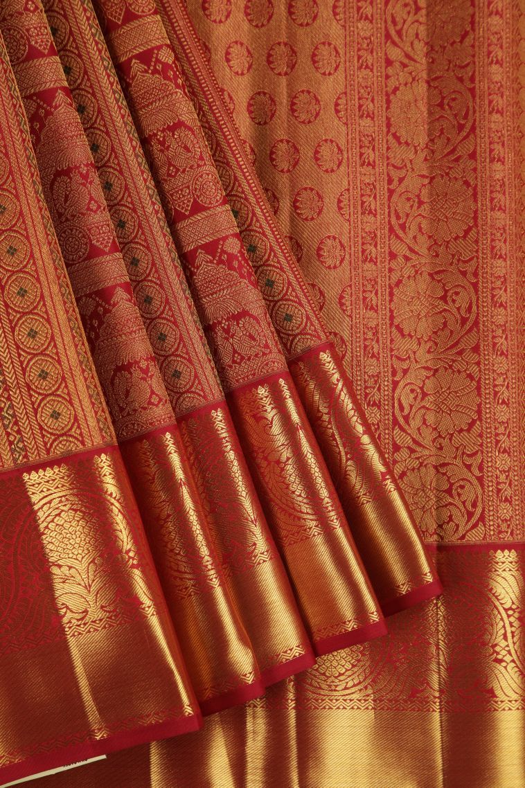 Dawn Red Kanchipuram Silk Sarees with Gold Zari Peacock Motifs view 1