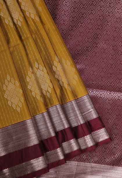 Honey Orange Soft Silk Saree with Silver Zari Floral Puttas